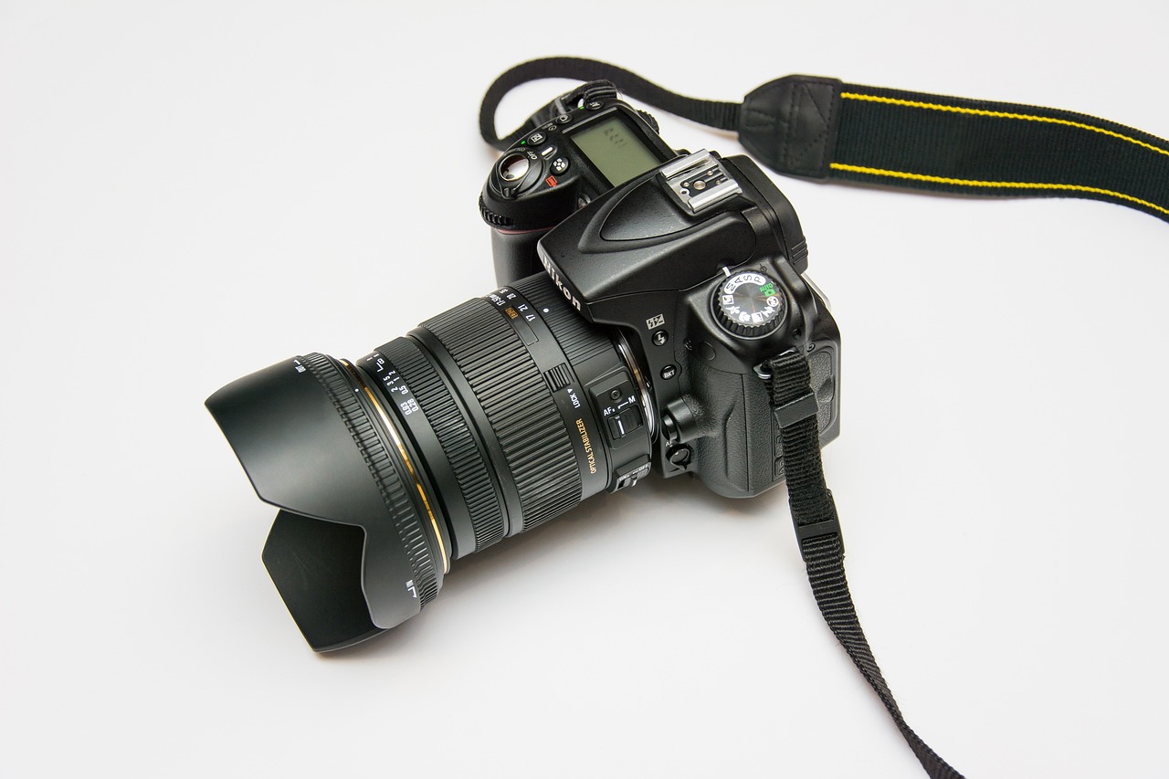 Black DSLR camera on white background